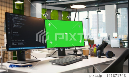 Empty startup office with green screen PC and artificial intelligence program running on monitors. Mockup computer display in AI industry startup workspace leveraging machine learning technology Empty startup office with green screen PC and artificial intelligence program running on monitors. Mockup computer display in AI industry startup workspace leveraging machine learning technology 141871748
