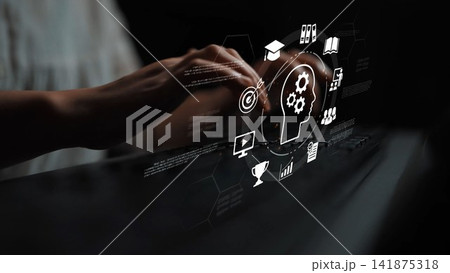 Digital concept of knowledge management with human head silhouette and various symbols representing education, technology, and data analysis in a dark background Gluon 141875318