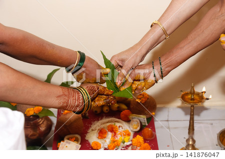 Turmeric rituals are performed in Indian Hindu weddings with mango leaves. Turmeric rituals are performed in Indian Hindu weddings with mango leaves. 141876047