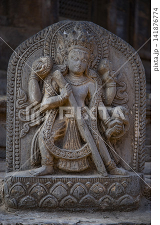 Ancient Hindu stone carving statue of deity in Patan Nepal with copy space Ancient Hindu stone carving statue of deity in Patan Nepal with copy space 141876774
