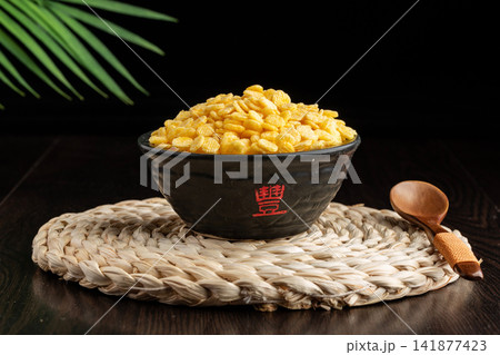flaked corn cereal and meal replacement powder served in a bowl flaked corn cereal and meal replacement powder served in a bowl 141877423
