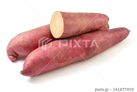 raw red skin sweet potato pile on white background raw red skin sweet potato pile on white background 141877459