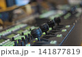 Broadcast switcher control panel with illuminated green buttons and joysticks with copy space 141877819