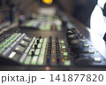 Professional video production switcher console with glowing green buttons and copy space 141877820