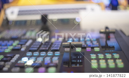 Video production switcher T-bar fader control panel with colorful buttons and copy space Video production switcher T-bar fader control panel with colorful buttons and copy space 141877822