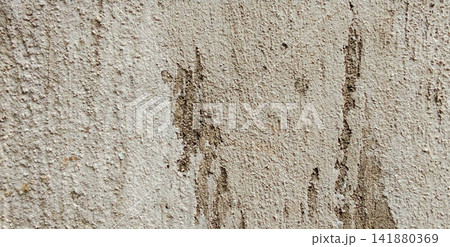 Weathered concrete wall with peeling plaster texture. Weathered concrete wall with peeling plaster texture. 141880369