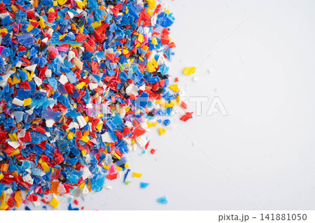 Plastic colorful pieces recycling shredded for industrial use. Plastic colorful pieces recycling shredded for industrial use. 141881050