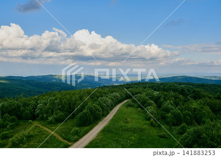 Winding Road and Wind Farm Landscape Winding Road and Wind Farm Landscape 141883253