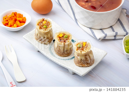 steamed glutinous rice shumai dumpling with savory meat filling 141884235