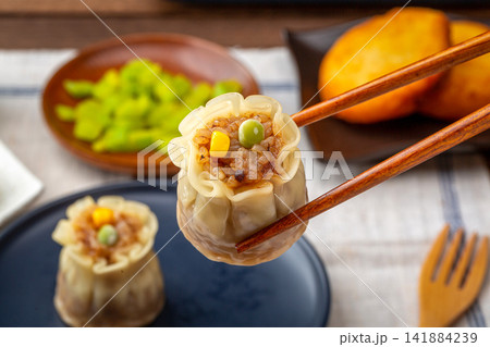 steamed glutinous rice shumai dumpling with savory meat filling 141884239