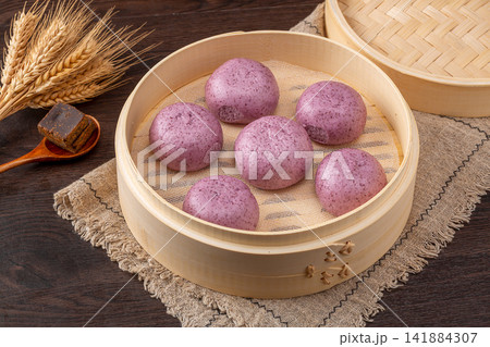 steamed purple sweet potato buns with sweet mashed potato filling 141884307