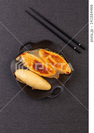 pan fried cornmeal potstickers with crispy golden lace crust 141884466