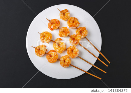 grilled Shrimp Skewers Seasoned with Barbecue Spices and Herbs 141884875