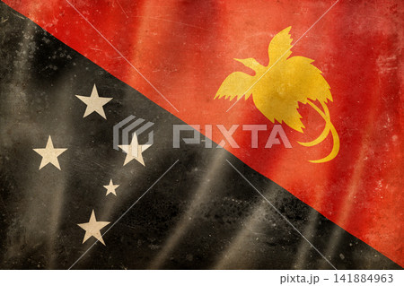 Old vintage flag of Papua New Guinea, worn and stained 141884963