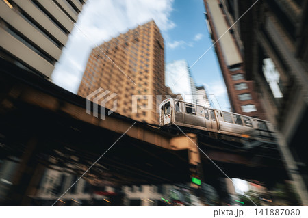 Train on elevated railway above street in downtown Chicago Train on elevated railway above street in downtown Chicago 141887080