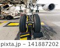 Front landing gear of commercial airplane during preparation before flight 141887202