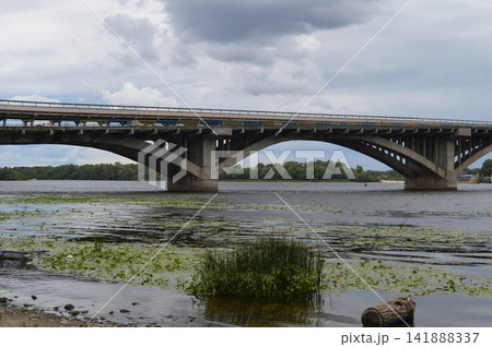 The southern bridge of Kyiv across the Dnipro river - river panorama The southern bridge of Kyiv across the Dnipro river - river panorama 141888337