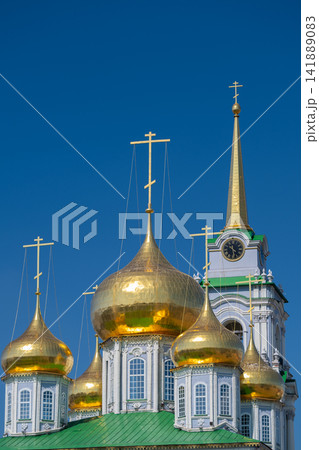 Golden domes shine under the blue sky at the Cathedral of the Assumption in Tula Russia revealing architectural beauty and rich history Golden domes shine under the blue sky at the Cathedral of the Assumption in Tula Russia revealing architectural beauty and rich history 141889083