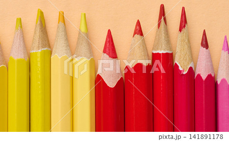 Multicolored wooden pencils in a row, drawing and creativity tools 141891178