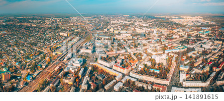 Aerial view of Homiel cityscape in autumn day. Bird's-eye view of railway station building and residential district. Gomel, Belarus. Panorama, panoramic view Aerial view of Homiel cityscape in autumn day. Bird's-eye view of railway station building and residential district. Gomel, Belarus. Panorama, panoramic view 141891615