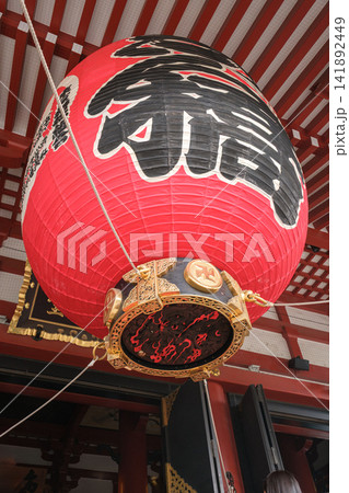 Large red lantern with black calligraphy hanging at temple entrance in Japan Large red lantern with black calligraphy hanging at temple entrance in Japan 141892449