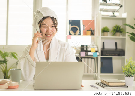 Young Asian Woman Working Online, Relaxing and Practicing Self Care During Daily Life at Home 141893633