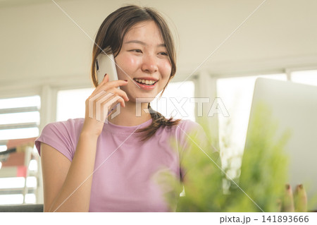 Young Asian Woman Working Online, Relaxing and Practicing Self Care During Daily Life at Home 141893666