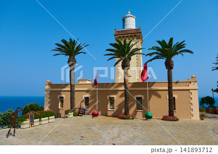 Lighthouse and palm trees on a seaside terrace in Tangier, Morocco 141893712