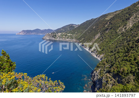 Cinque Terre along the rugged Ligurian shore in Italy from an elevated hiking trail Cinque Terre along the rugged Ligurian shore in Italy from an elevated hiking trail 141893797
