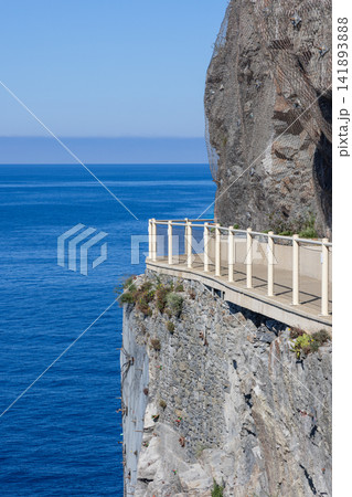 Via dell Amore at Cinque Terre in Liguria, Italy with empty path projecting from sheer cliff Via dell Amore at Cinque Terre in Liguria, Italy with empty path projecting from sheer cliff 141893888