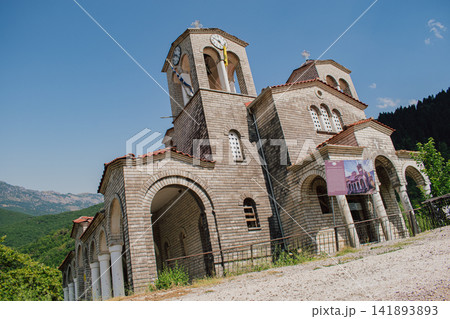 Leaning Panagia Theotokos stone church in abandoned sinking village of Ropoto after massive landslide disaster near Trikala Thessaly Greece stock photo 141893893