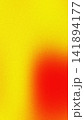 Bright yellow background with a bold splash of fiery red, creating a dynamic visual contrast 141894177