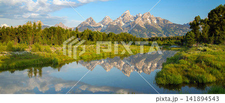 Mountain Landscape with River Reflection and Forest at Sunrise Mountain Landscape with River Reflection and Forest at Sunrise 141894543