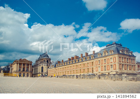 Versailles Palace Courtyard with Historic French Architecture and Blue Sky Versailles Palace Courtyard with Historic French Architecture and Blue Sky 141894562
