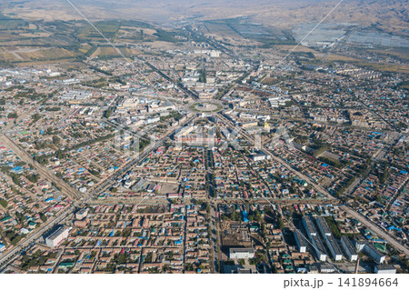 Aerial Cityscape of Mountain Valley Town with Roads and Farmland Aerial Cityscape of Mountain Valley Town with Roads and Farmland 141894664