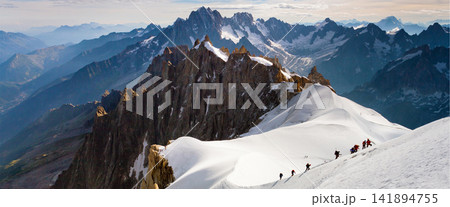 Mountain Climbers on Snowy Alpine Ridge Panorama Mountain Climbers on Snowy Alpine Ridge Panorama 141894755