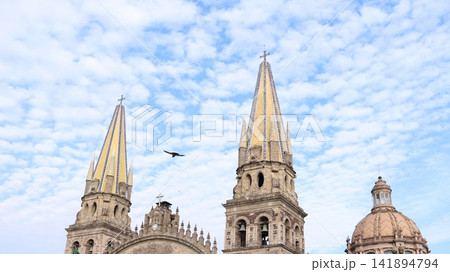 Historic Cathedral Towers Under Blue Cloudy Sky 141894794