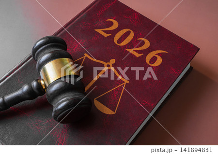 Judge wooden gavel on red law book with scales of justice emblem and 2026 text, legal and court concept Judge wooden gavel on red law book with scales of justice emblem and 2026 text, legal and court concept 141894831