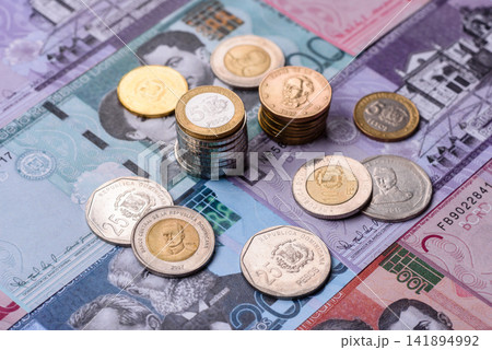 Dominican peso banknotes and coins as a instrument of trade and exchange. Dominican peso Dominican peso banknotes and coins as a instrument of trade and exchange. Dominican peso 141894992