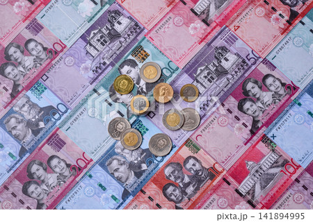 Dominican peso banknotes and coins as a instrument of trade and exchange. Dominican peso Dominican peso banknotes and coins as a instrument of trade and exchange. Dominican peso 141894995