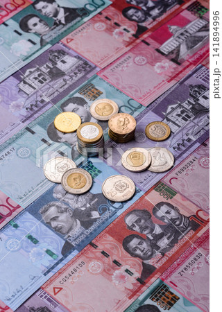 Dominican peso banknotes and coins as a instrument of trade and exchange. Dominican peso Dominican peso banknotes and coins as a instrument of trade and exchange. Dominican peso 141894996