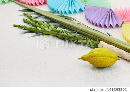 Sukkot four species set with festive decorations 141895291