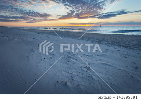 Sandy beach of the Baltic Sea with sunset Sandy beach of the Baltic Sea with sunset 141895391