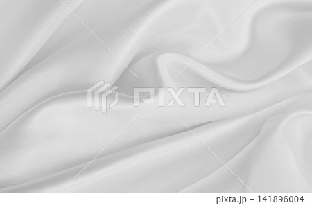 Smooth elegant white silk or satin luxury cloth texture as wedding background. Luxurious background design Smooth elegant white silk or satin luxury cloth texture as wedding background. Luxurious background design 141896004