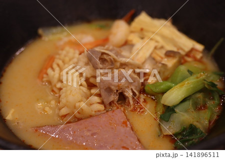 Steaming Bowl of Flavorful Asian Soup 141896511