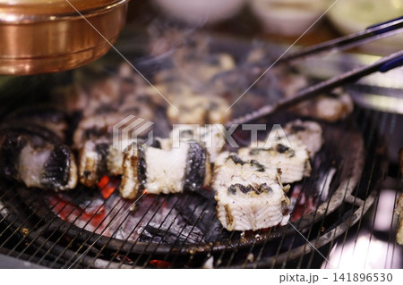 Grilled Sushi Rolls on Charcoal Grill 141896530