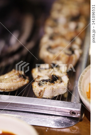 Grilled Chicken on Rotisserie Grill Grilled Chicken on Rotisserie Grill 141896531