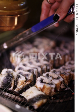 Grilled Food on Grill with Tongs Grilled Food on Grill with Tongs 141896543