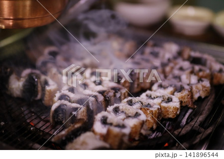 Grilled Sushi Rolls on Charcoal Grill 141896544