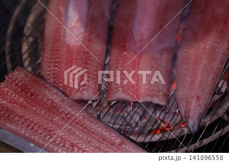 Grilled Fish on Charcoal Grill 141896558